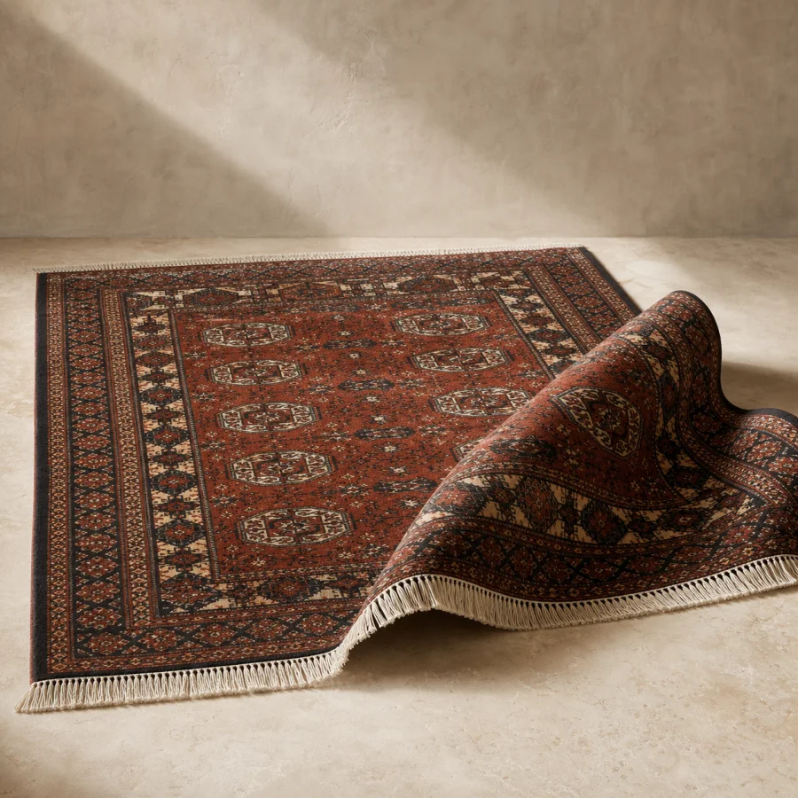 Deep rust Bokhara-inspired hand-knotted wool carpet with geometric motifs